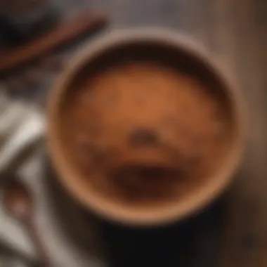 A wooden bowl filled with carob powder set on a rustic table